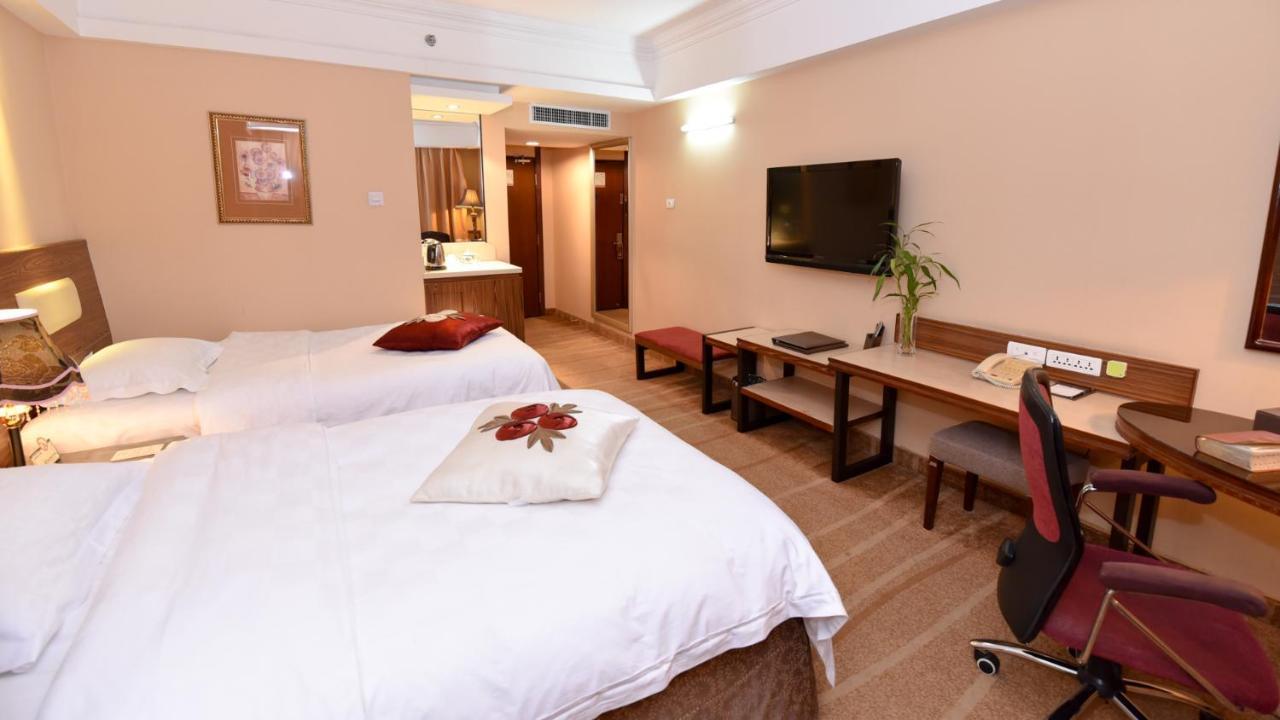 Bremen Holiday Hotel Harbin Bagian luar foto